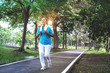 © chomplearn_2001 - Senior Asian sport woman jogging in the Jogging track, feel happy and smiling, elderly health care