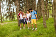 © BGStock72 - Group of four friends hiking together through a forest