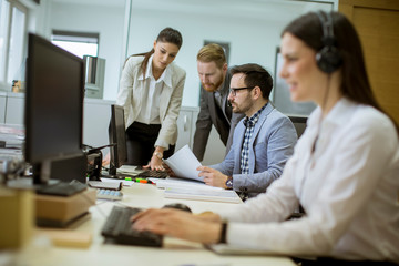 People working in a busy office