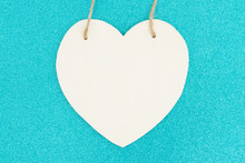 Wood Heart On Bright Teal Glitter Background