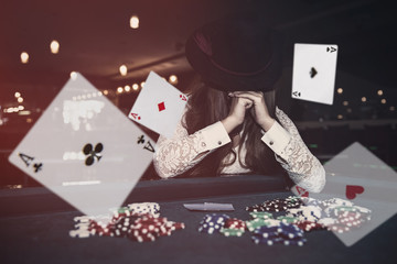 Woman with closed face with hat and falling cards