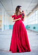© stivog - Beautiful teen girl in long, glamorous red dress going to her prom or dance