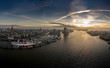 Luftaufnahme von Hamburg mit Elbphilharmonie, Landunsgbrücken, Speicherstadt und Hafencity bei Sonnenaufgang