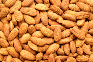Sticker - Almonds top view texture, background, dry fruit also called as badam.