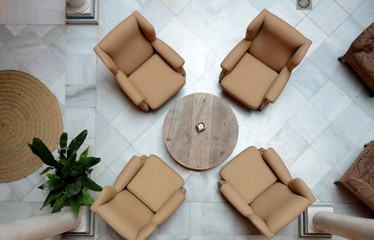 Top view of four chairs around a coffee table