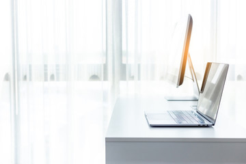 Office workplace with laptop on white table , white office desk 