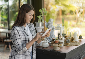 Sticker - happy woman using digital tablet in cafe