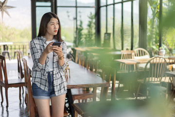 Sticker - woman using smartphone in cafe