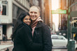 © Nick Starichenko - Happy young adult multicultural couple in love hugging and smiling on New York City street