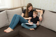© Alexandr - beautiful young family mother and son do homework lessons