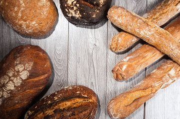 different types of bread on wood