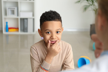 Wall Mural - Little boy at speech therapist office