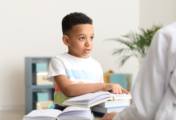 Wall Mural - Little boy at speech therapist office