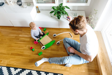 Wall Mural - Father and son playing 