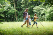 © BalanceFormCreative - Mother and her little sons hiking trough forest .