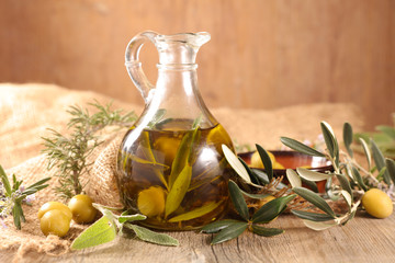 Wall Mural - oil olive bottle with branch