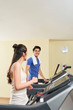 © DragonImages - Couple training on treadmills