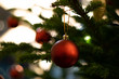 Red hanging Christmas decoration on fir Christmas tree