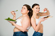 happy slim woman eating doughnuts while sad overweight woman eating green spinach leaves