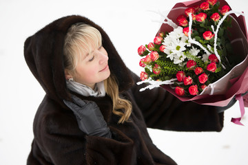 Happy woman with a bouquet of flowers