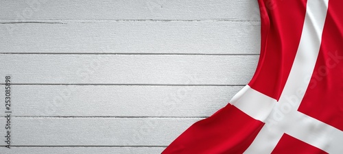 Denmark flag, on top of white wood. Wrinkled fabric. Wallpaper Mural