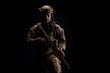 © kaninstudio - Special forces United States soldier or private military contractor holding rifle. Image on a black background. war, army and people concept