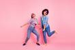 © deagreez - Full length body size portrait of two person nice-looking cool crazy careless carefree attractive charming playful girls wearing casual checkered shirt having fun isolated over pink pastel background