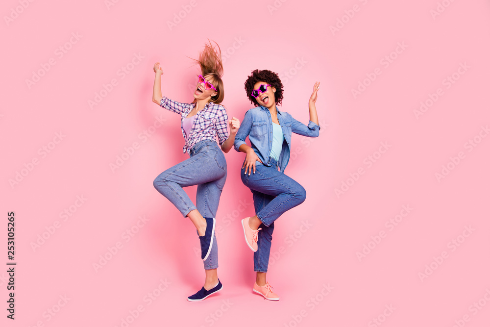 Full length body size profile side view portrait of two person nice carefree attractive playful cheery girls in casual checkered shirt having fun rejoice isolated over pink pastel background - obrazy, fototapety, plakaty 