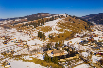 Wall Mural - Moldovita Monastery, above view in a sunny winter day