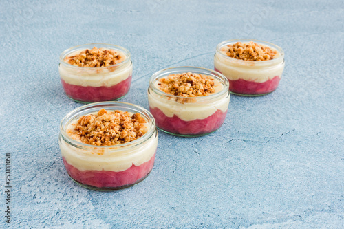 Fotomural Pink Rhubarb and Custard Dessert with Crumbs in Ramekins