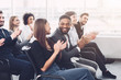 © Prostock-studio - Business training. Colleagues clapping hands at seminar
