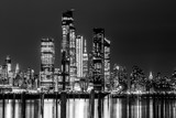 Fototapeta  - New York City Manhattan Midtown Panorama at Night with Skyscrapers illuminated over Hudson River.