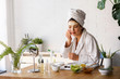 © lordn - Young woman cleaning face with natural cosmetics. Clean fresh skin care.