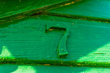 Green Number Seven On Fence