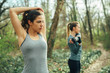 © GAGO IMAGES - Two young beautiful woman exercise in the forest