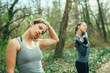 © GAGO IMAGES - Two young beautiful woman exercise in the forest