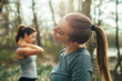 © GAGO IMAGES - Two young beautiful woman exercise in the forest