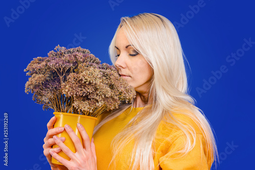 A Beautiful Girl With Snow White Hair In A Yellow Hoodie On A