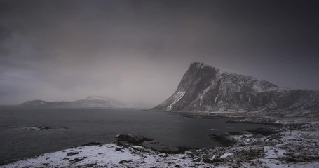 Wall Mural - Timelapse of stormy sunset over Offersoykammen mountain, Lofoten