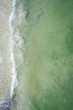 Waves crashing on beach drone overhead