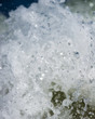 Macro waves crashing water drop