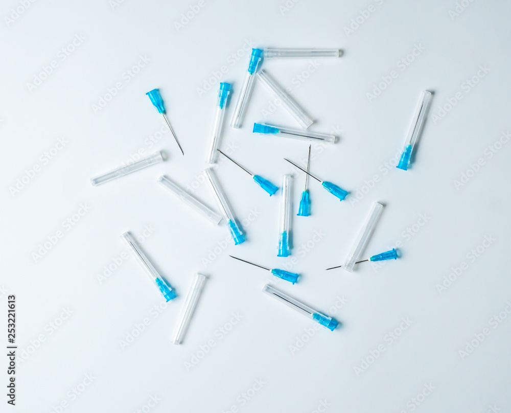 Hypodermic syringe. Syringes with blue needles. Medical Injectors on ...