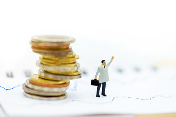 Wall Mural - Miniature people:  Businessmen standing with coins stack, Finance, investment and growth in business concept.