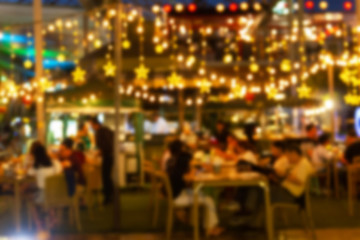 Wall Mural - abstract blur image Lots of people enjoy the fun of night festival in a restaurant and The atmosphere is happy and relaxing.