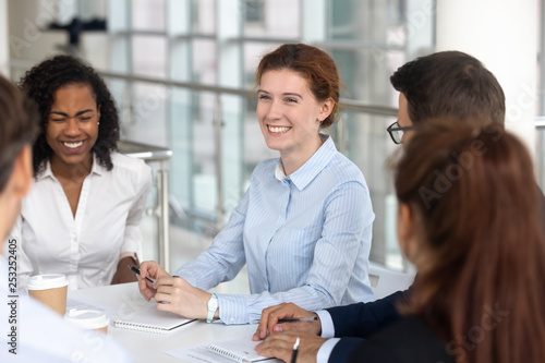 Cuadros en Lienzo Multiracial business people take a break during negotiations joking laughing