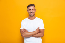 Handsome Happy Excited Man Posing Isolated Over Yellow Wall Background.