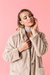 © Drobot Dean - Young pretty woman posing isolated over pink wall background wearing accessories and jewelry.