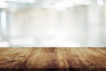 empty wooden table on abstract blurred background