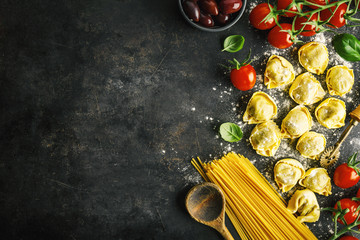 Wall Mural - Italian food background on dark