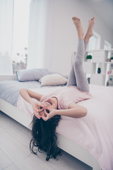 Poster - Vertical full length body size photo funky she her little girl lying bed upside down fingers specs okey symbol playful wear home t-shirt pants comfortable apartments flat light colored room indoors